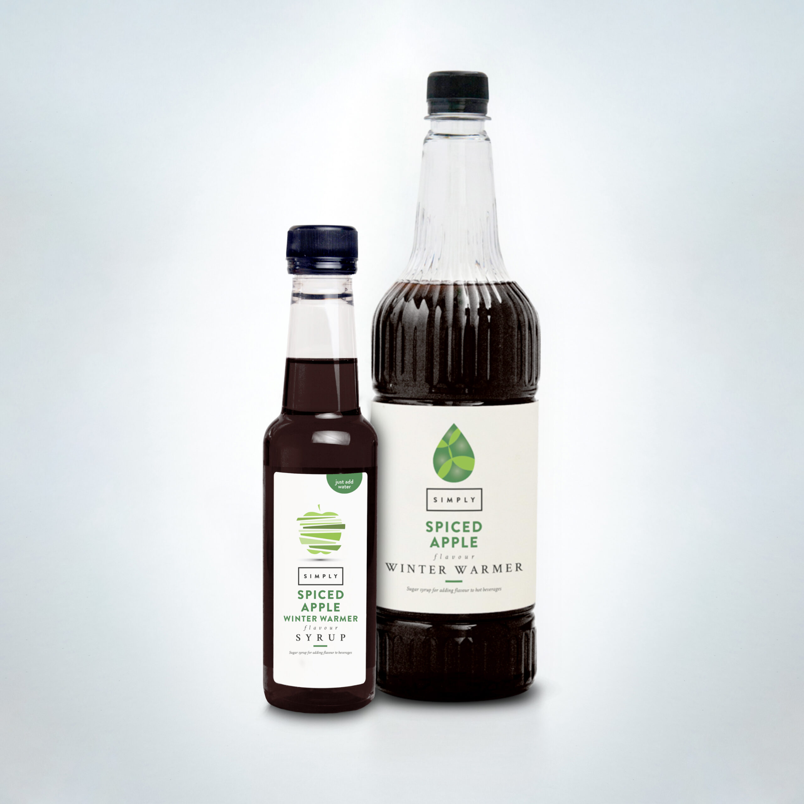 Simply Spiced Apple Syrup duo in bottles. A sweet and warming syrup with apple and spice notes, perfect for autumn lattes, hot drinks, and seasonal menus in cafés, coffee shops, and hospitality venues
