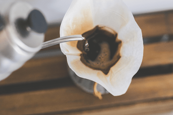 Fresh coffee grounds blooming during pour-over brew – highlighting quality and precision by Mini & Mighty Espresso