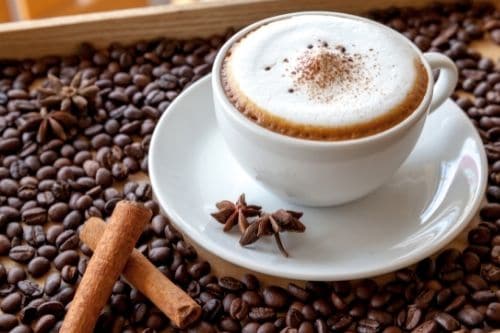 Barista preparing a cappuccino with velvety foam, showcasing expert skill in coffee art and high-quality coffee service