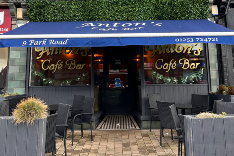 Front view of Anton’s Café Bar in St Anne's, a local favourite proudly serving Mini & Mighty Coffee with outdoor seating and a welcoming atmosphere.