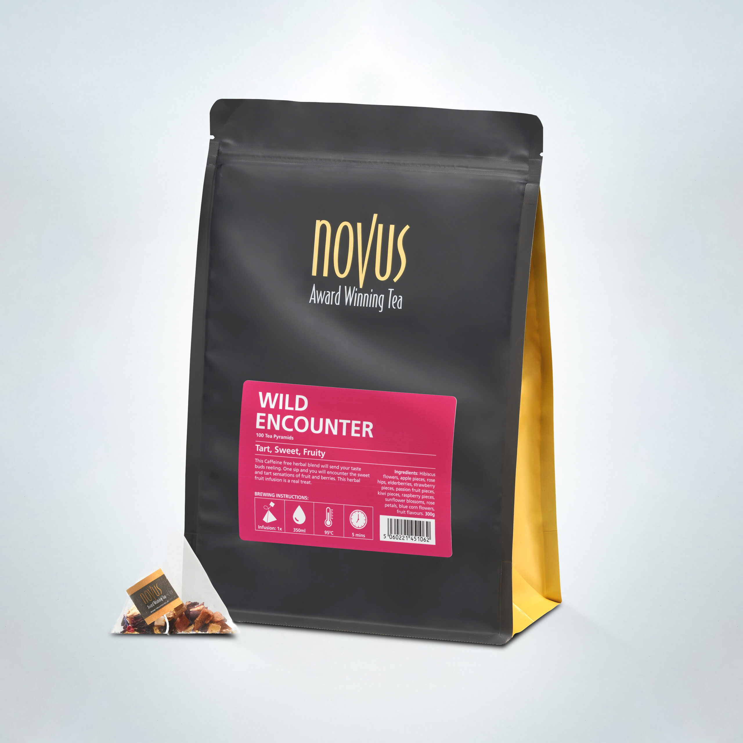 Novus Award Winning Wild Encounter Tea in a 100-pyramid bag pack, featuring a tart, sweet, and fruity caffeine-free infusion, presented with a pyramid tea bag and sleek black and gold packaging